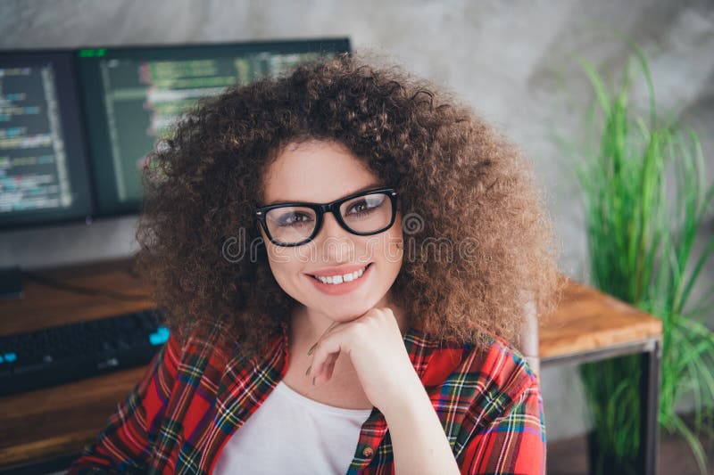 Confident Female Programmer Working in a Modern Workspace with a Coding Screen Setup Wearing Casual Checkered Shirt stock photos