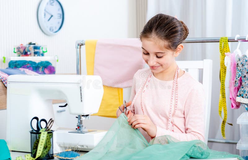 Young Female Seamstress Working at the Sewing Machine Stock Photo ...