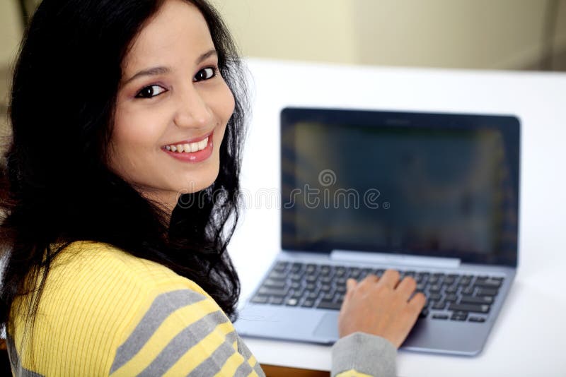 Young female student using tablet computer