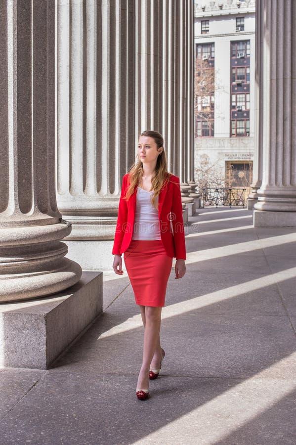 A Woman in Red Blazer and Pants Holding a Louis Vuitton Bag · Free Stock  Photo