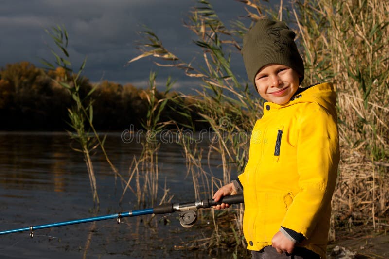 Young Fisherman. Preschooler Boy, Dressed in Yellow Jacket, is Fishing  Stock Image - Image of angler, nature: 262665611