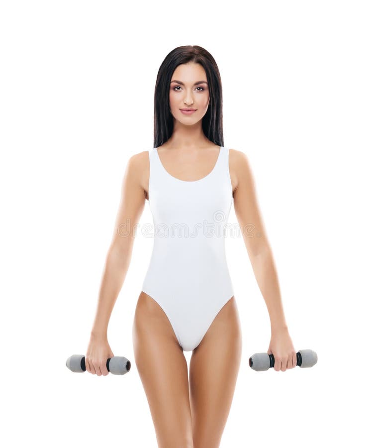 Young and fit girl pumping a dumbbells. Woman in sporty swimsuit. Sport, fitness and healthy lifestyle concept. royalty free stock images Young and fit girl pumping a dumbbells. Woman in sporty swimsuit. Sport, fitness and healthy lifestyle concept. royalty free stock images