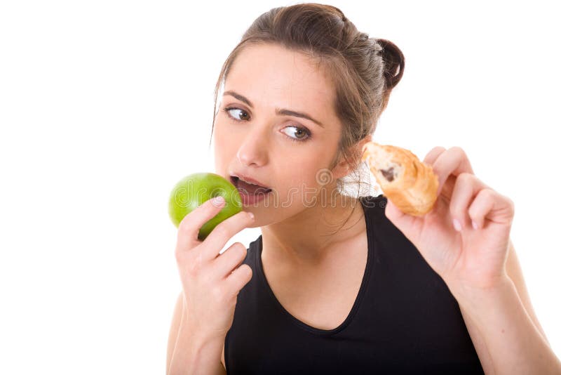 Young fit woman making decision what to eat