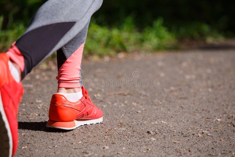 Young fitness woman hiker legs at forest trail stock photos Young fitness woman hiker legs at forest trail stock photos