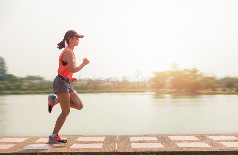 Young fitness woman running in the park royalty free stock photos Young fitness woman running in the park royalty free stock photos