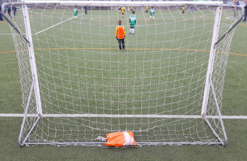 Young football goalkeeper during a training game. A young football goalkeeper during a training game royalty free stock photos Young football goalkeeper during a training game. A young football goalkeeper during a training game royalty free stock photos