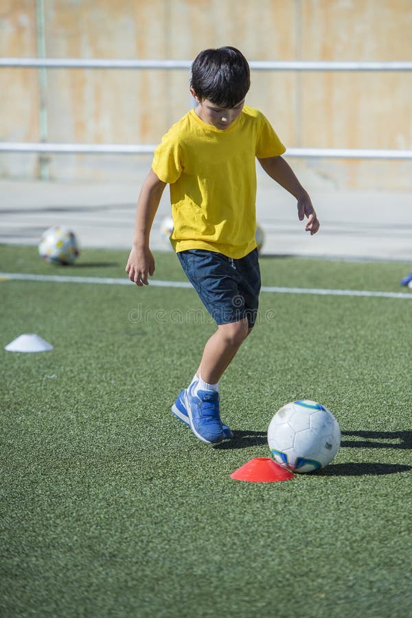 Young Football Player in a Training Stock Image Image of green