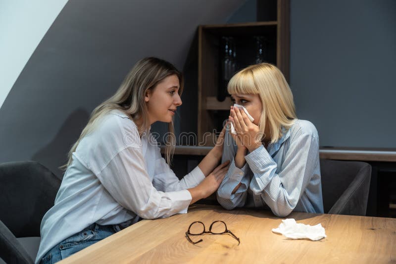 Young Friend Woman Comforting Her Sad Depressed Colleague In Office Who