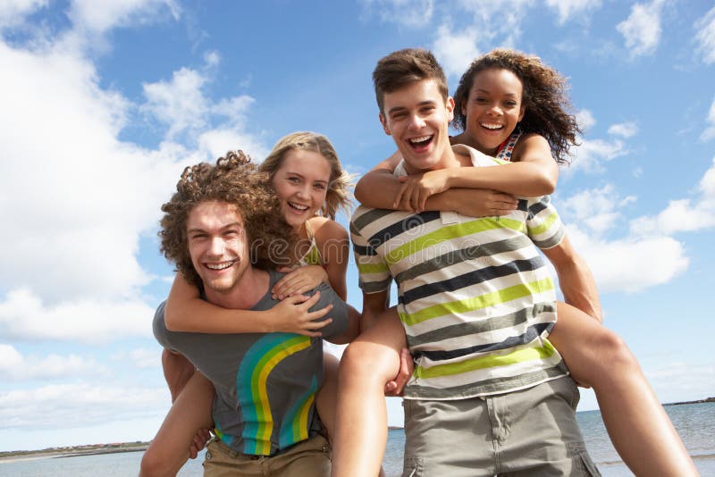 Young Friends Having Fun On Summer Beach