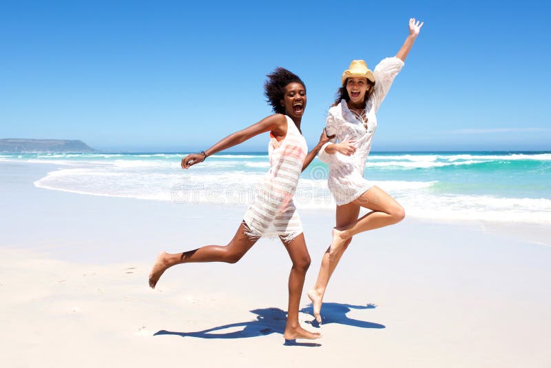 Young Friends Laughing and Running on the Beach Stock Photo - Image of ...