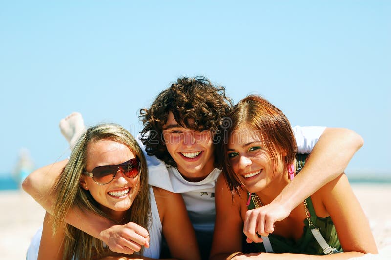 Young friends on the summer beach