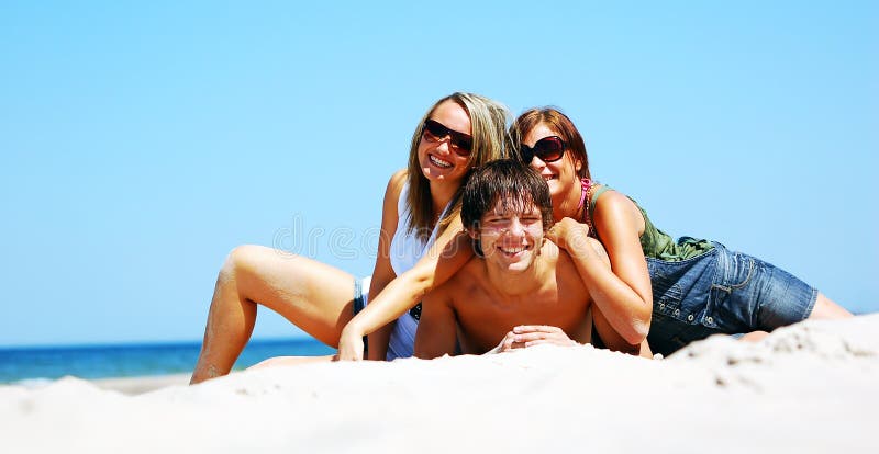 Young friends on the summer beach