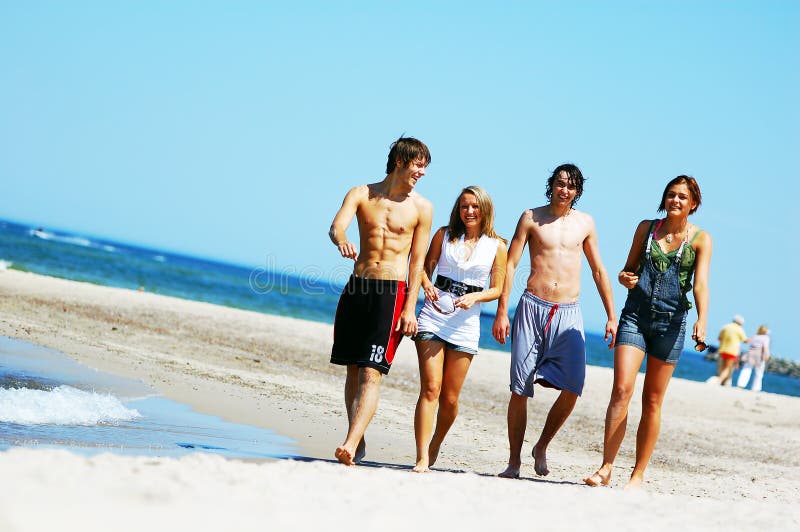 Young friends on the summer beach