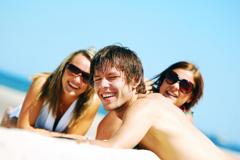 Young friends on the summer beach