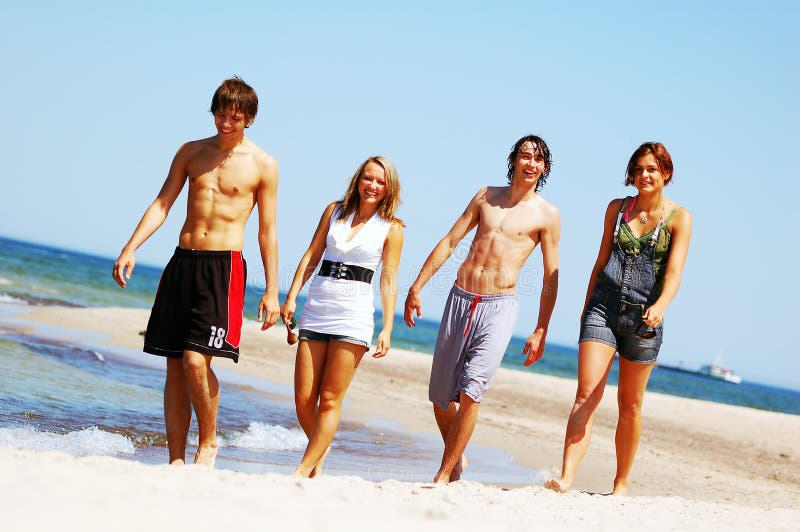 Young friends on the summer beach