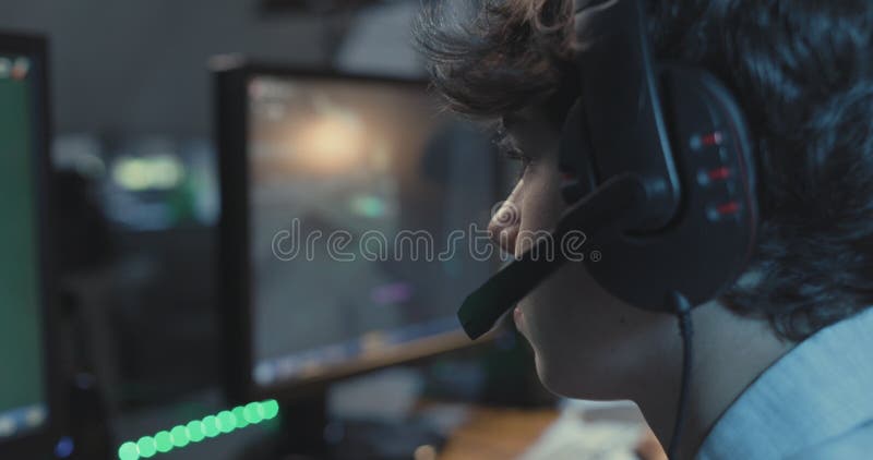 Young gamer playing video games at home stock video footage