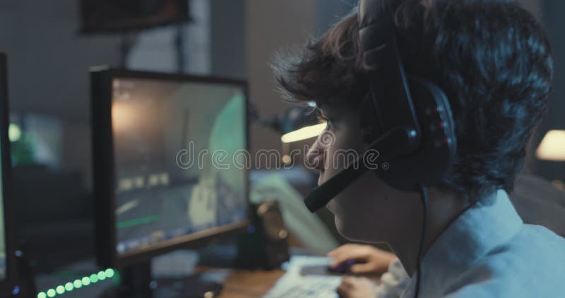 Gamers playing FPS games together at home stock footage