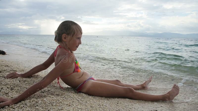 The Young Girl on the Beach Stock Footage - Video of coral, fish: 65400720