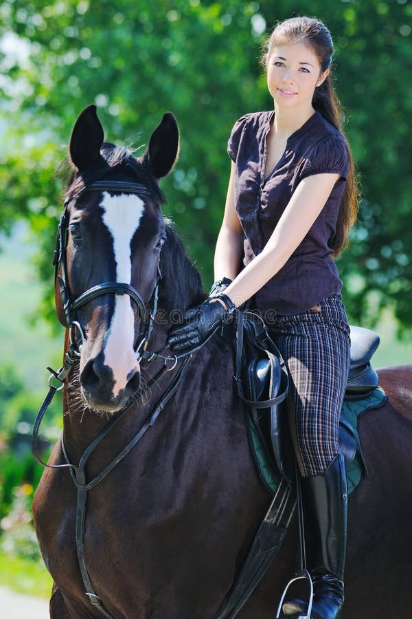 Young Girl And Black Horse Stock Photo - Image: 21996112