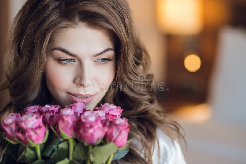 Young girl with a bouquet of roses