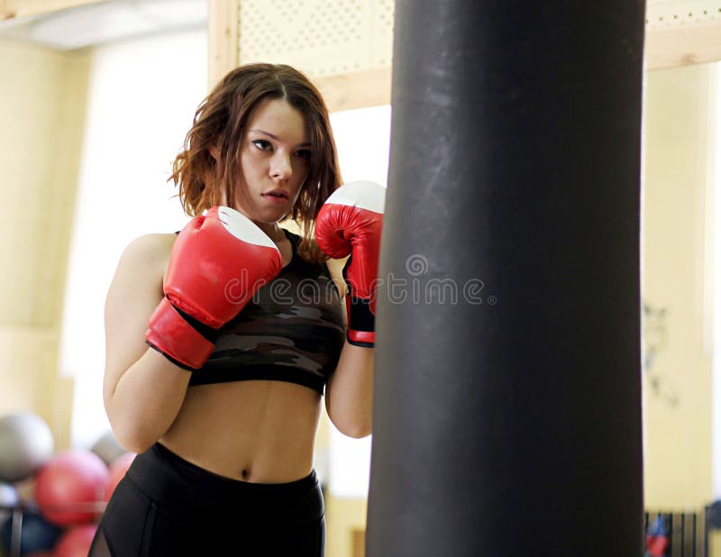 Young girl with boxing gloves