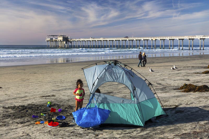 Young Girl Camping on La Jolla Shores Beach north of San Diego California stock photography Young Girl Camping on La Jolla Shores Beach north of San Diego California stock photography