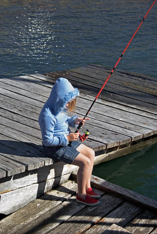 Child Fishing On A Beach Stock Photo by ©DesignPicsInc 31605009