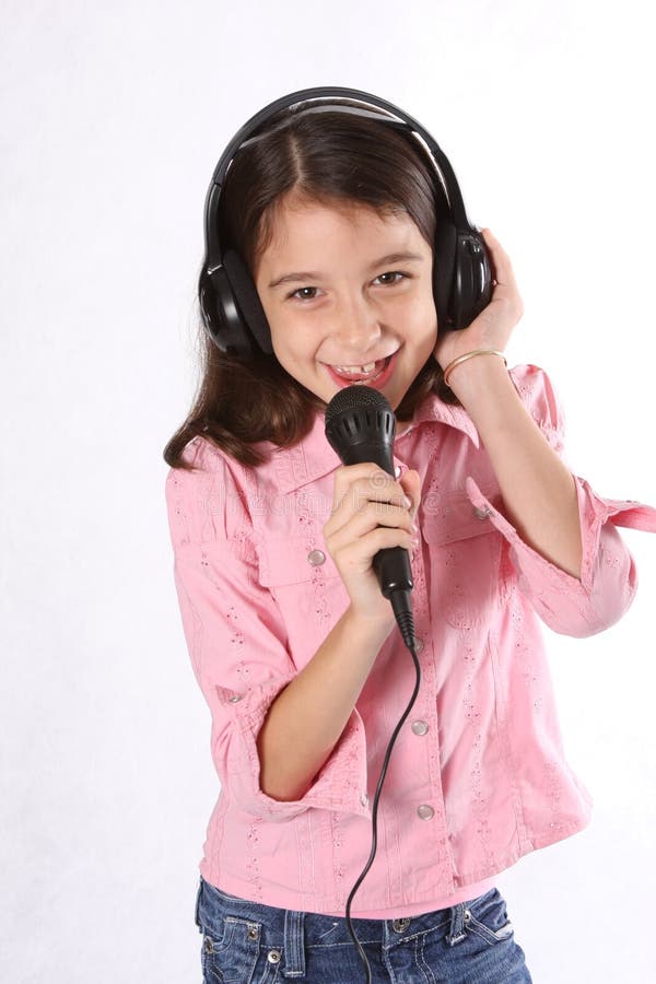 Young Girl Child Singing  With Microphone Stock Photo 