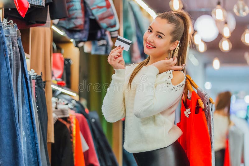 The Young Girl Chose the Things she Wants To Buy. Stock Photo - Image ...
