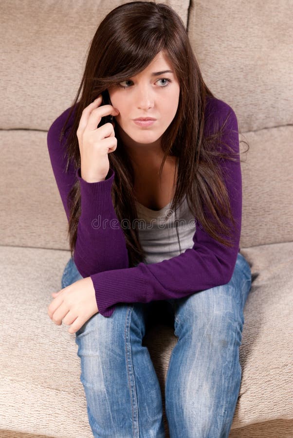 Young girl concerned talking by telephone bad