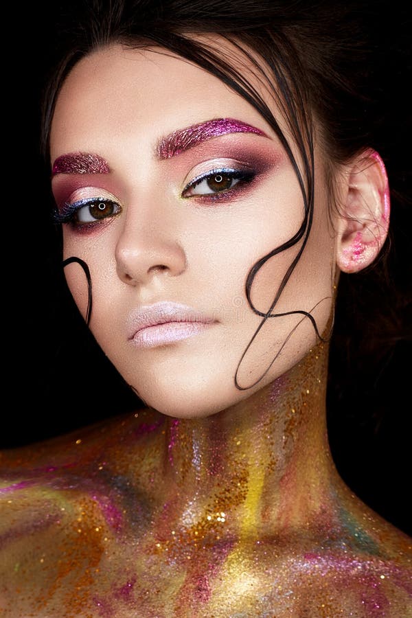 A Young Girl with Creative Makeup and Shiny Eyebrows. Beautiful Model ...