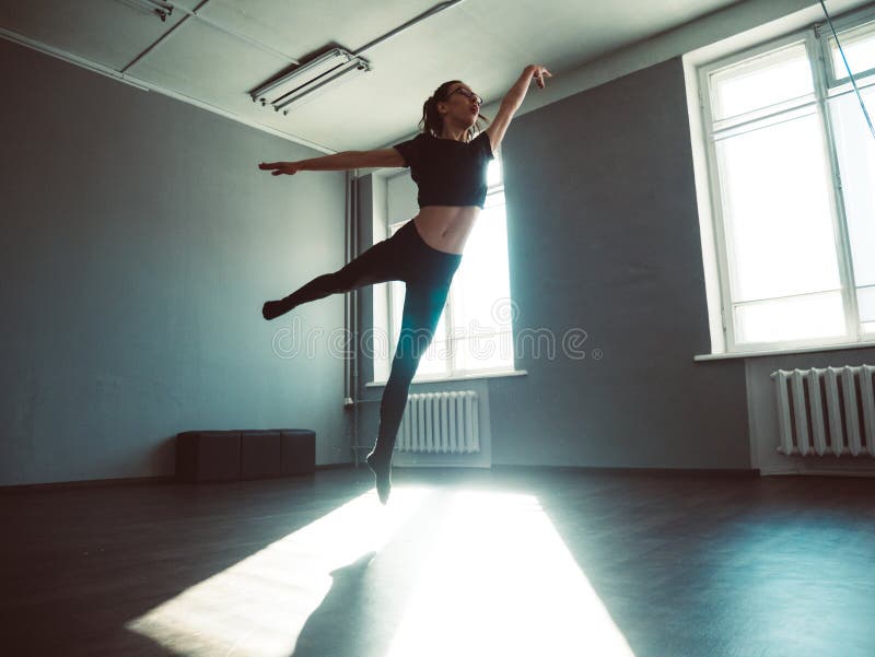 Young girl dancing contemp. Dynamic shot in the jump. stock image Young girl dancing contemp. Dynamic shot in the jump. stock image