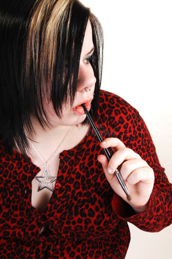 Young girl doing makeup.