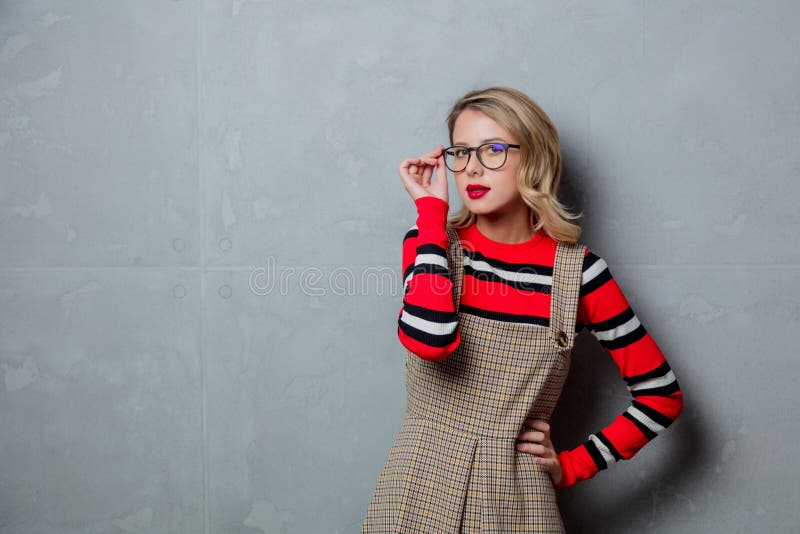 Young girl in dress and striped sweater royalty free stock image Young girl in dress and striped sweater royalty free stock image