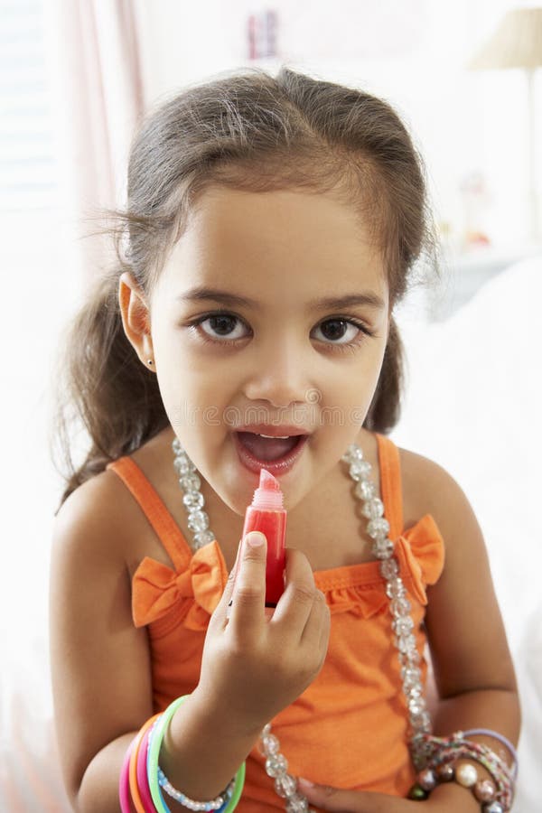Young Girl Dressing Up and Putting on Make Up Stock Photo Image of