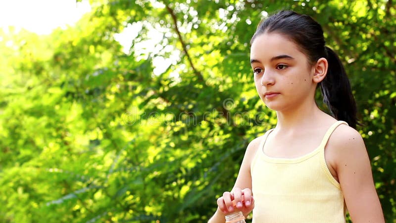 Young girl drinking water