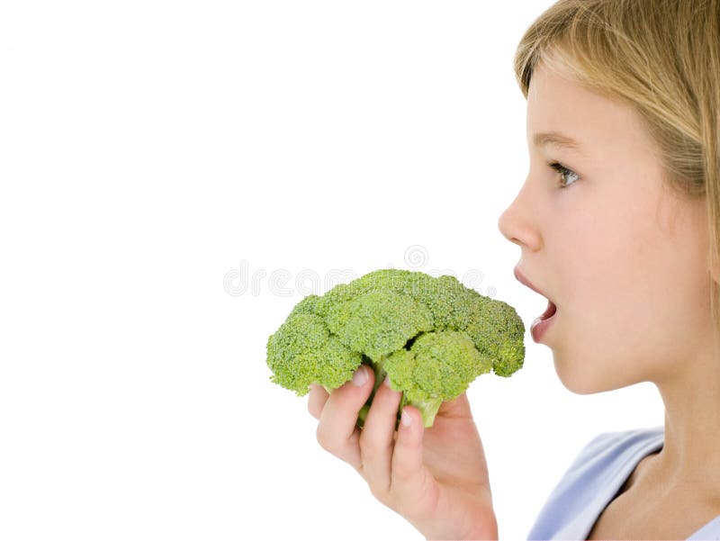 Young girl eating broccoli stock photo. Image of profile 5945798