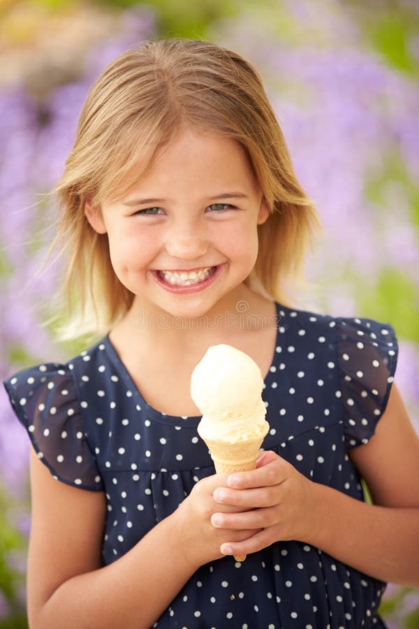 Young Girl Eating Ice Cream Outdoors