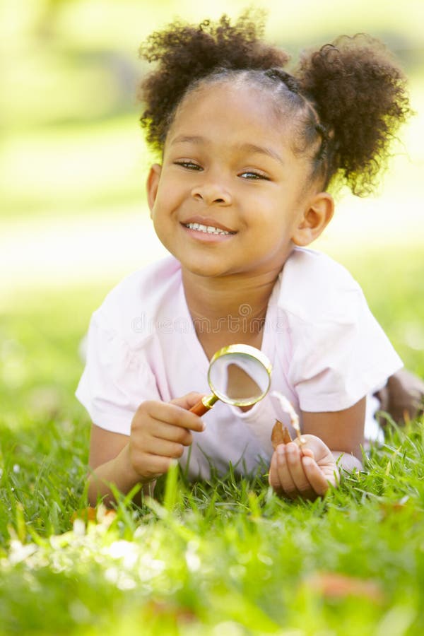 Young girl exploring nature stock images