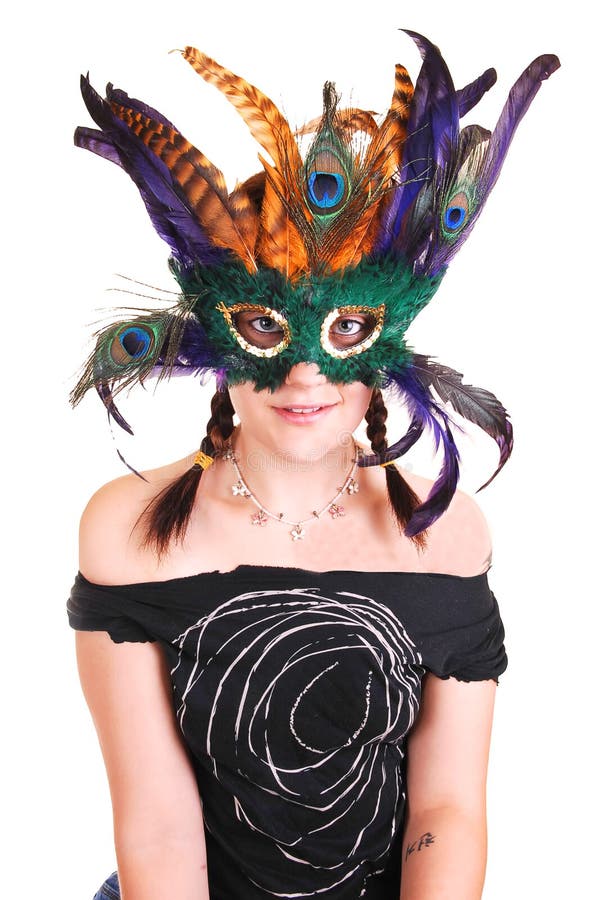 Young girl with feather mask.