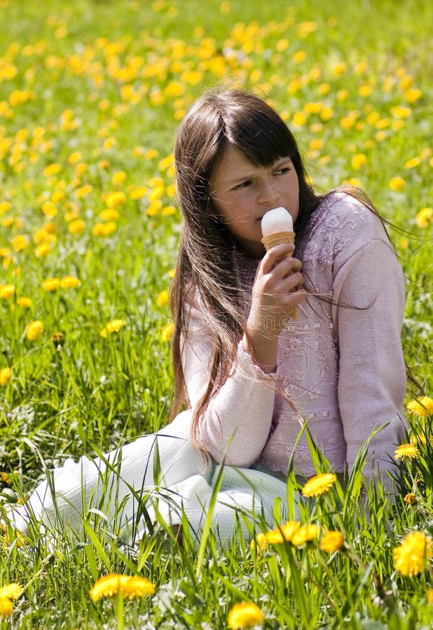 Young girl in a flower meadow