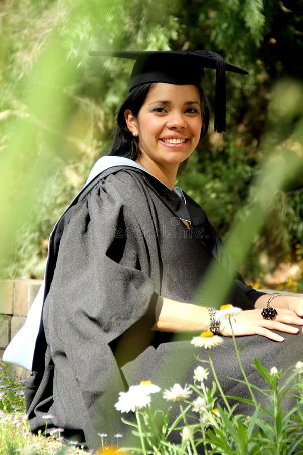 Young girl girl in a graduation gown.