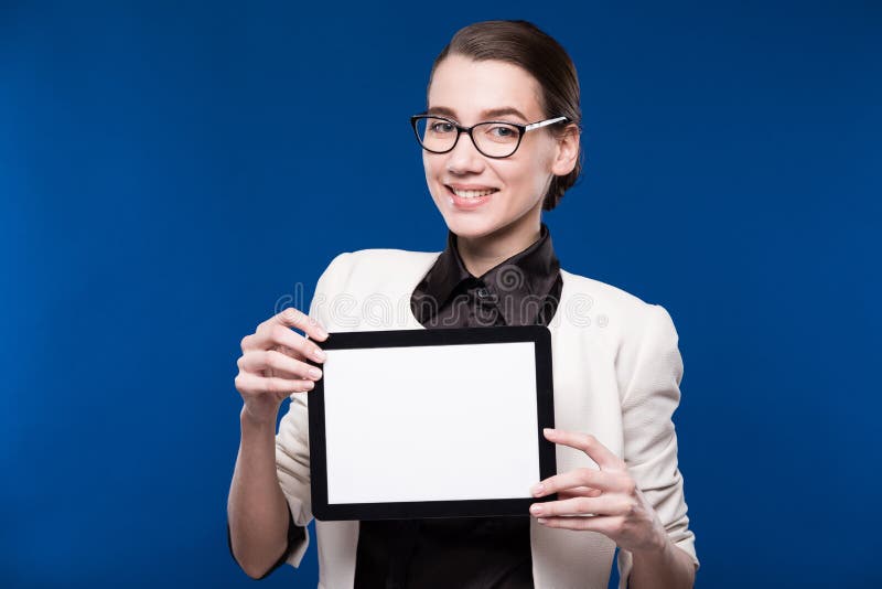 Young girl in glasses with the tablet