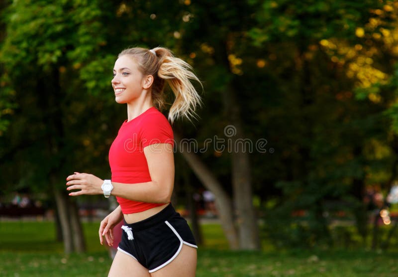 Woman jogging in the park  Women, Jogging, Girl short hair