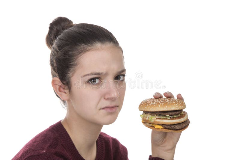 Young Girl with a hamburger royalty free stock photography Young Girl with a hamburger royalty free stock photography