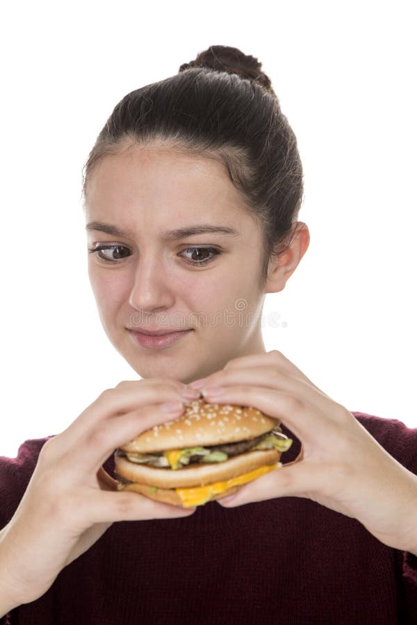 Young Girl with a hamburger stock photos