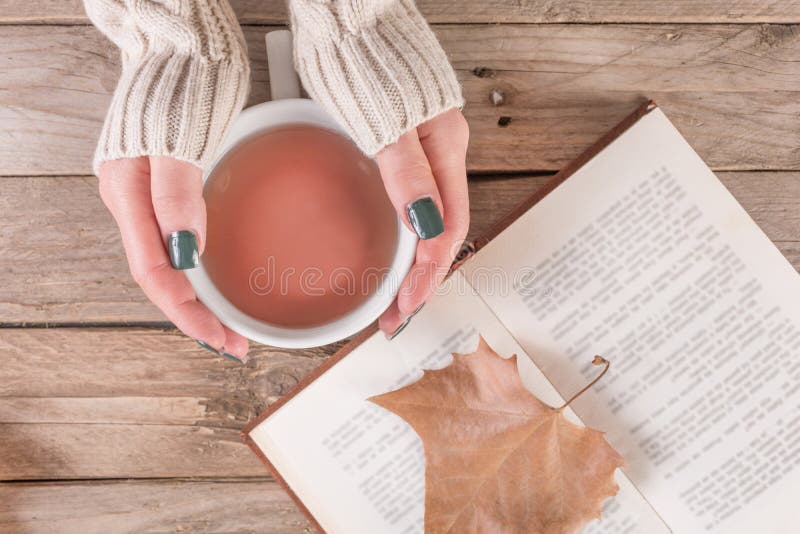 Autumn Delights: Tea, Books, and Falling Leaves