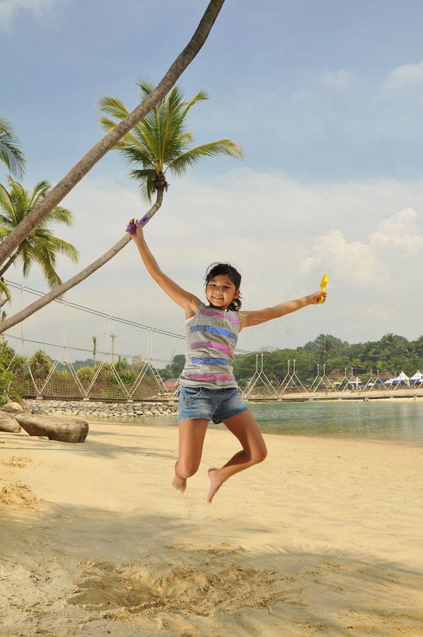 Young Girl Having Fun At The Beach