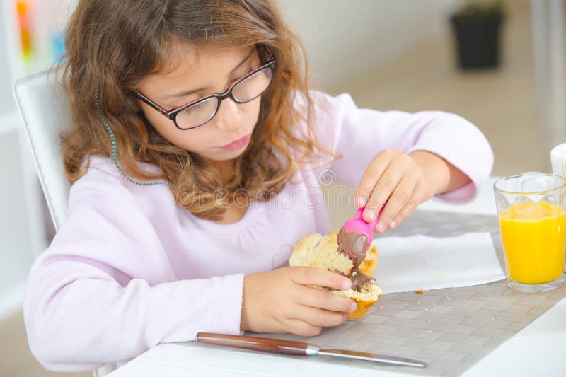 Young girl having snack royalty free stock image