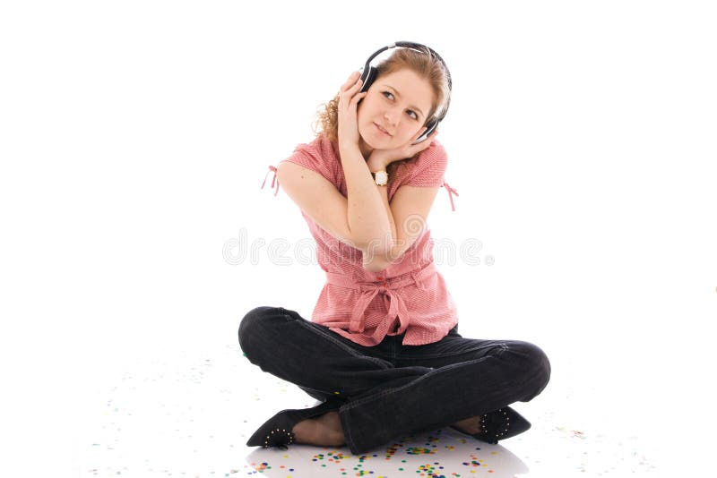 The young girl with a headphones isolated